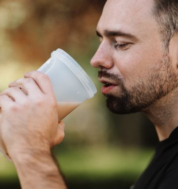 Man is drinking a protein shake